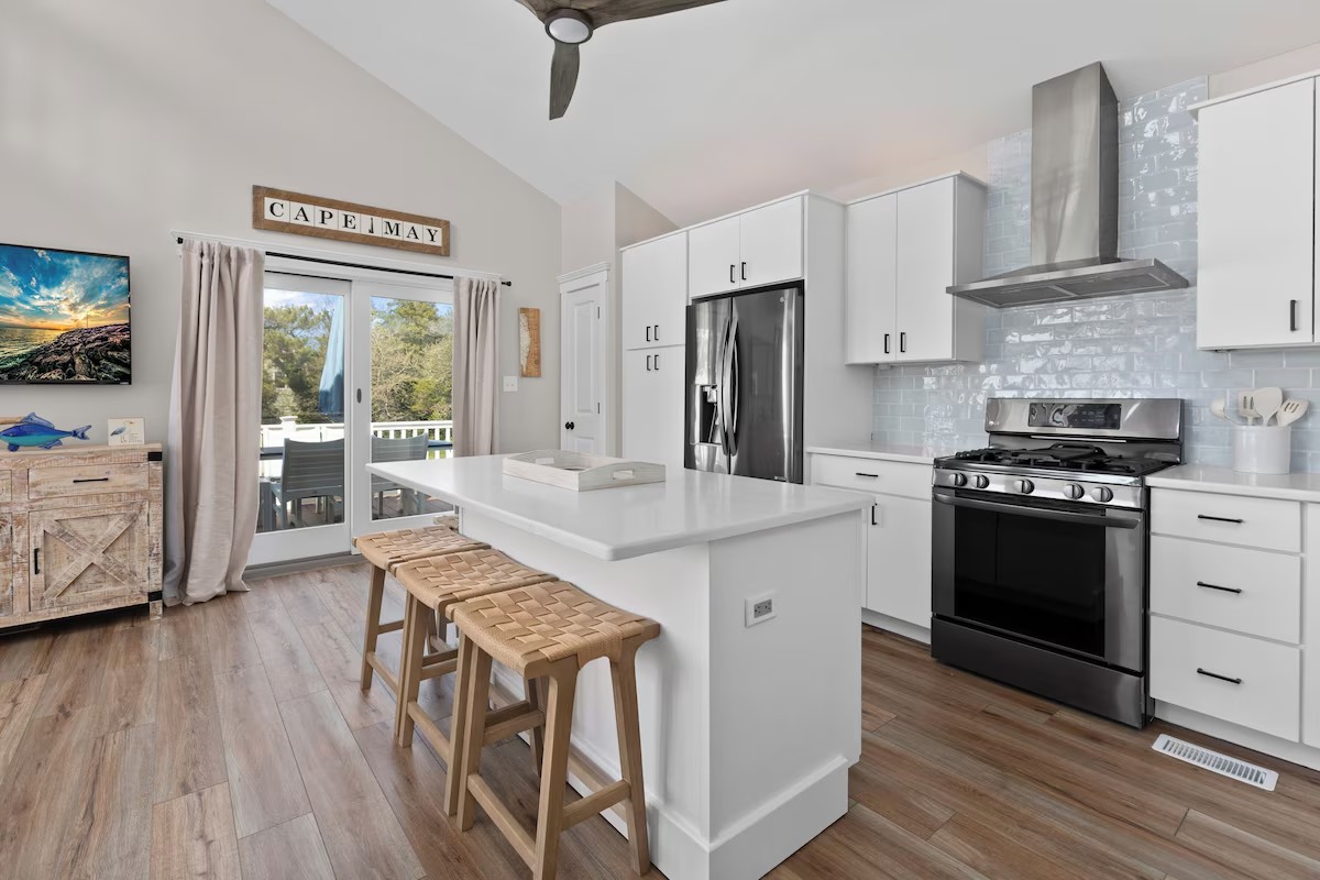 Bright white kitchen with island seating